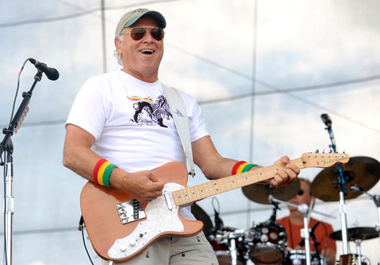 Jimmy Buffett performs with Ilo and the Coral Reefer Allstars during Bonnaroo 2009 on June 13, 2009 in Manchester, Tennessee. (Photo by Tim Mosenfelder/Getty Images)