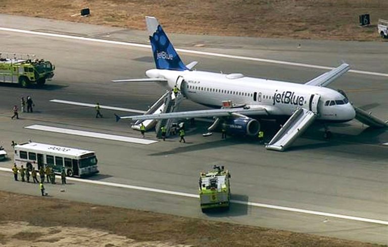 This still frame from video provided by KABC-TV shows a JetBlue airliner on the Long Beach Airport runway with emergency slides deployed in Long Beach, Calif.,Thursday, Sept. 18, 2014. The JetBlue Airbus A320 airliner experienced engine problems and returned to the Long Beach, California, Airport on Thursday after a short flight that ended with passengers evacuating the aircraft on emergency slides. (AP Photo/KABC-TV)
