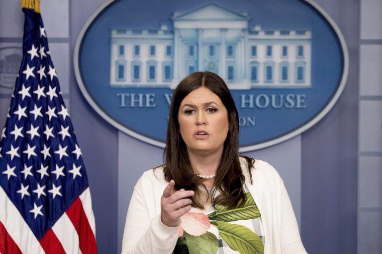 White House press secretary Sarah Sanders' hat was red with the words 