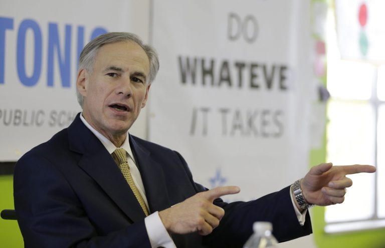 FILE - In this Dec. 11, 2013 file photo, Republican Attorney General Greg Abbott talks with educators at KIPP: San Antonio, in San Antonio, Texas. Abbott raised $11.5 million over three months, and Fort Worth Democrat Wendy Davis raised more than $12 million over the past six months, the campaigns reported Tuesday, Jan. 14, 2014. (AP Photo/Eric Gay, File)
