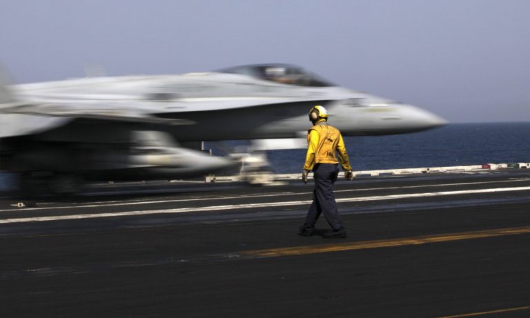 A U.S. F/A-18 fighter jet takes off for Iraq from the flight deck of the U.S. Navy aircraft carrier USS George H.W. Bush, in the Persian Gulf, Monday, Aug. 11, 2014.  U.S. military officials say American fighter aircraft struck and destroyed several vehicles Sunday that were part of an Islamic State group convoy moving to attack Kurdish forces defending the northeastern Iraqi city of Irbil. (AP Photo/Hasan Jamali)