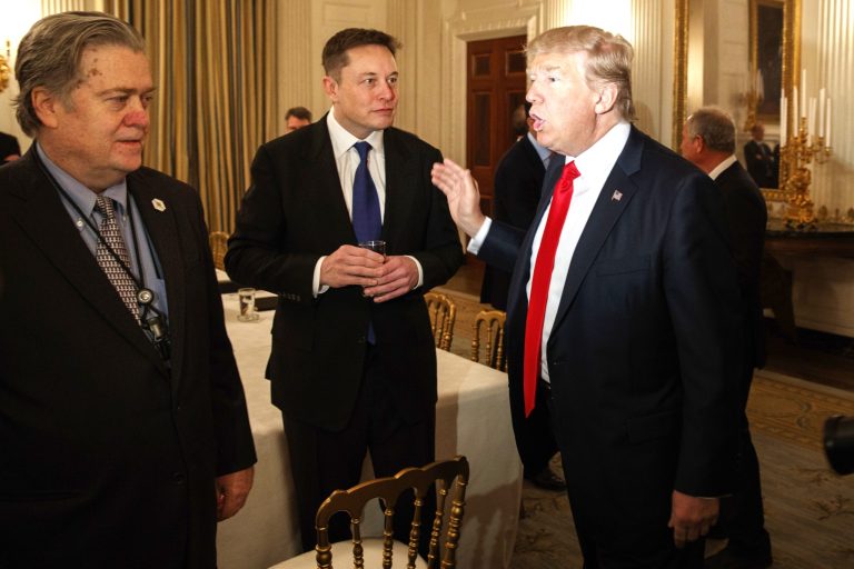 President Trump talks with Tesla and SpaceX CEO Elon Musk, center, and White House chief strategist Steve Bannon during a meeting with business leaders in the State Dining Room of the White House on Feb. 3. (AP Photo/Evan Vucci)