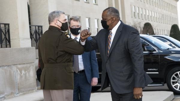 Defense Secretary Lloyd J. Austin III greets Deputy Defense Secretary David L. Norquist and Chairman of the Joint Chiefs of Staff Gen. Mark A. Milley, upon arrival at the Pentagon after being confirmed as secretary of defense, Washington, D.C., Jan. 22, 2021. 
