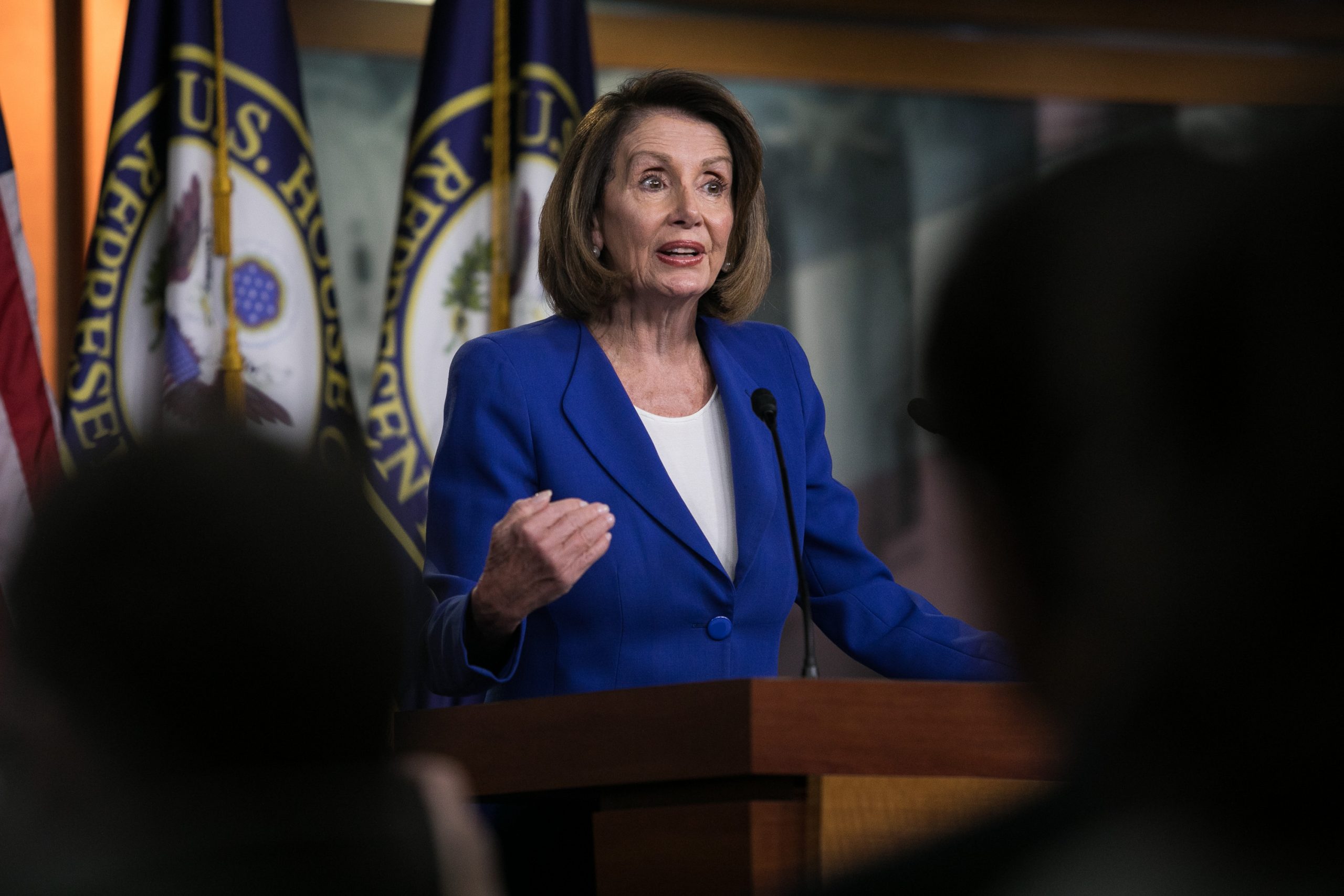 Pelosi holds Democrats together to pass spending deal