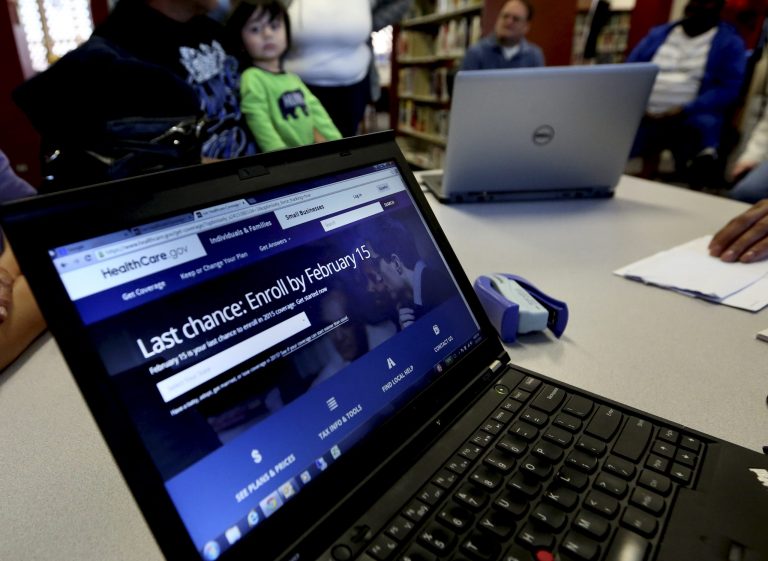 In this Thursday, Feb. 12, 2015 photo, a laptop shows the healthcare.gov website during an Affordable Care Act enrollment event at the Fort Worth Public Library in Fort Worth, Texas. (AP Photo/LM Otero)