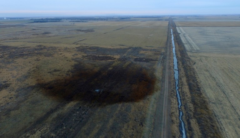 This aerial photo shows spills from TransCanada Corp.'s Keystone pipeline, Friday, Nov. 17, 2017, that leaked an estimated 210,000 gallons of oil onto agricultural land in northeastern South Dakota, near Amherst, S.D., the company and state regulators said Thursday, but state officials don't believe the leak polluted any surface water bodies or drinking water systems. Crews shut down the pipeline Thursday morning and activated emergency response procedures after a drop in pressure was detected resulting from the leak south of a pump station in Marshall County, TransCanada said in a statement. The cause was being investigated. (DroneBase via AP)