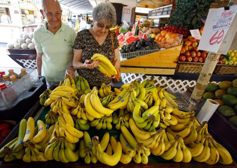 In this Aug. 15, 2007 file photo, Graham and Lola East shop for Chiquita bananas at a produce stand at the Farmers Market in Los Angeles. Not even a month after flatly rejecting a takeover bid by two Brazilian companies, Chiquita is softened its stance and will open its books to them.