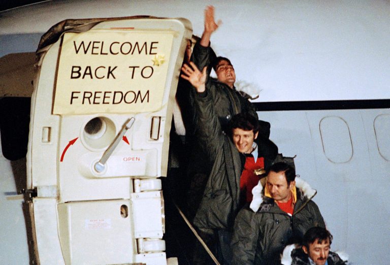 U.S. hostages arrive at Rhein-Main U.S. Air Force base in Frankfurt, West Germany, after their release from Iran, January 21, 1981. They are among 52 Americans held hostage in Iran for 444 days after their capture at the U.S. Embassy in Tehran. (AP Photo)