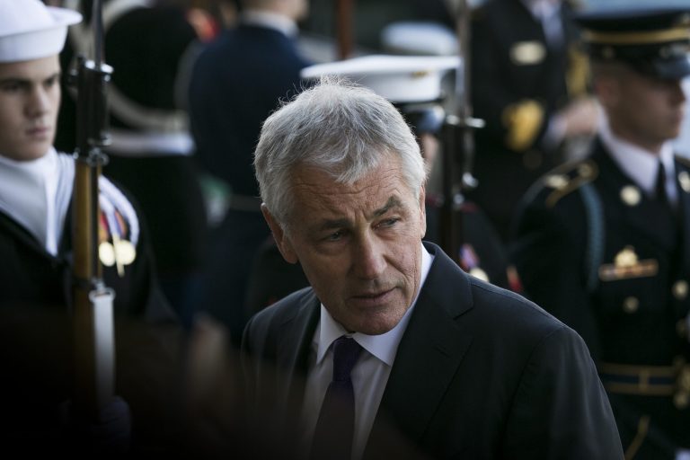 Defense Secretary Chuck Hagel looks on while welcoming New Zealand's Minister of Defense Gerry Brownlee, during an honor cordon at the Pentagon, Monday, Nov. 24, 2014. (Graeme Jennings/Examiner)