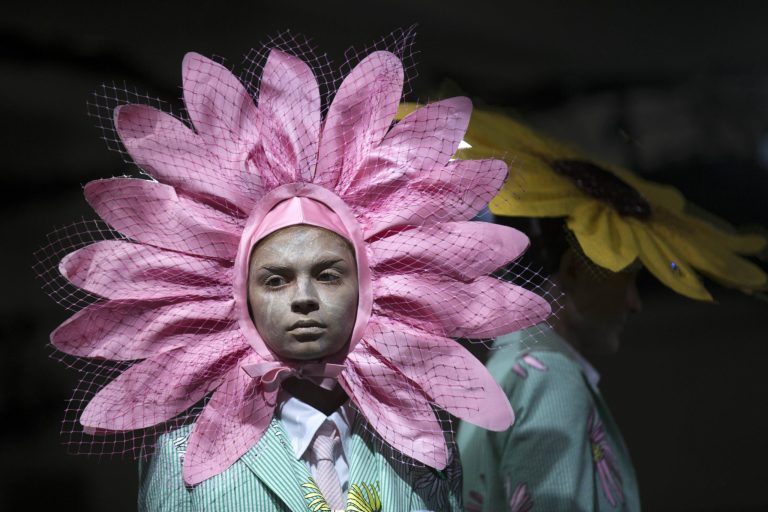 FILE - In this Monday, Sept. 8, 2014,  file photo, a model stands by the runway before the Thom Browne Spring 2015 collection is modeled during Fashion Week  in New York. (AP Photo/John Minchillo, File)