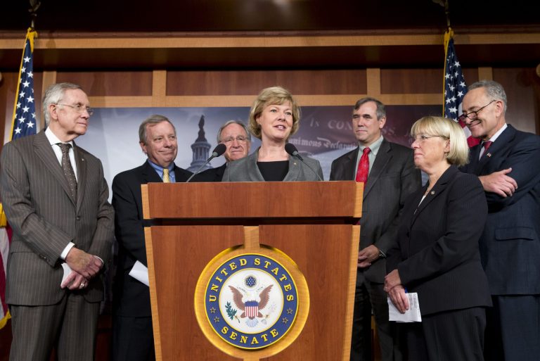 From left are, Senate Majority Leader Harry Reid of Nev., Senate Majority Whip Richard Durbin of Ill., Sen. Tom Harkin, D-Iowa, Baldwin, Sen. Jeff Merkley, D-Ore., Sen. Patty Murray, D-Wash., and Sen. Charles Schumer, D-N.Y. (AP/J. Scott Applewhite)