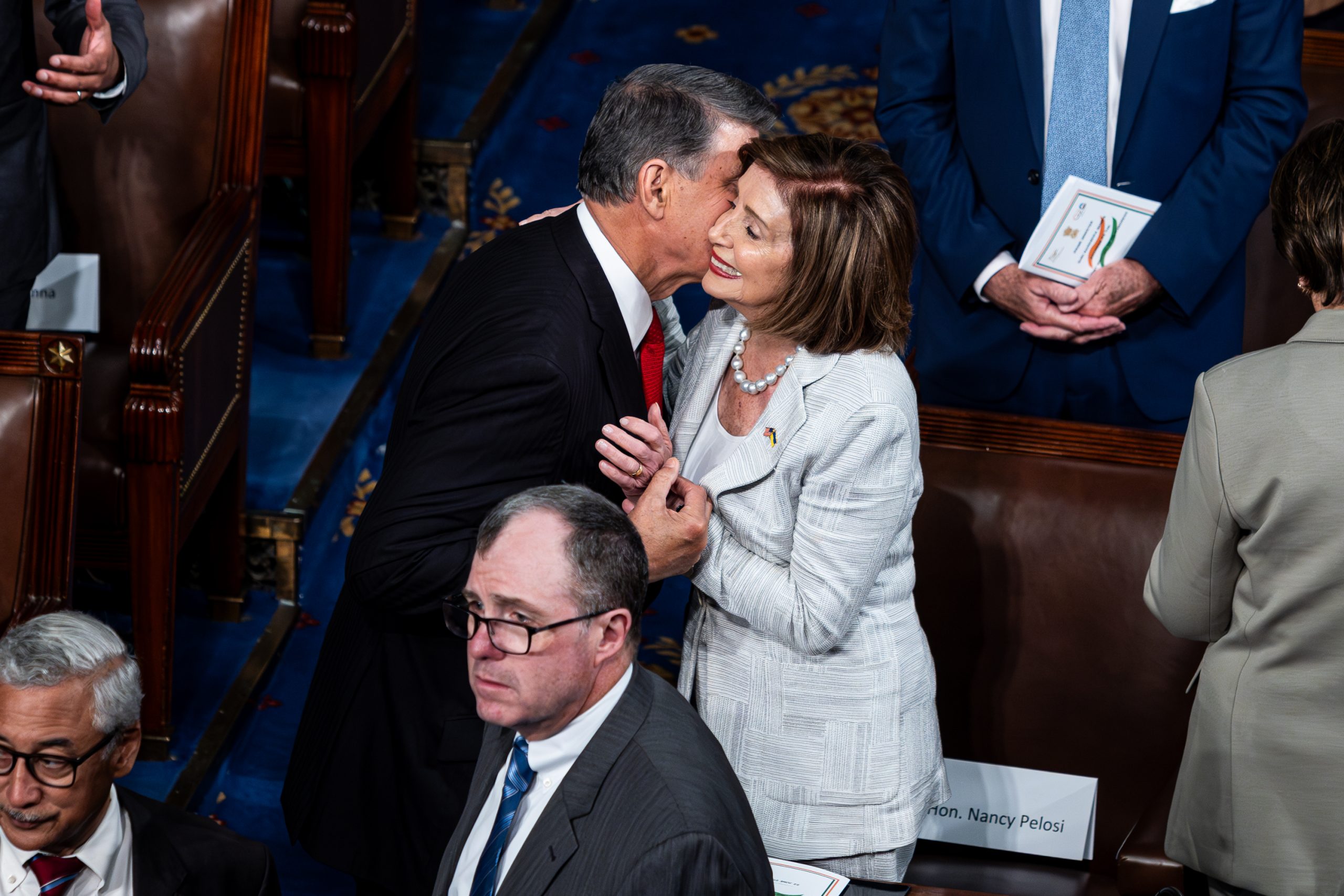 Sen. Joe Manchin (D-WV) kisses former House Speaker Nancy Pelosi (D-CA) on the House chamber floor, shortly before Prime Minister Narendra Modi's joint address to Congress. Manchin is flirting with a third-party run for the White House in 2024. 