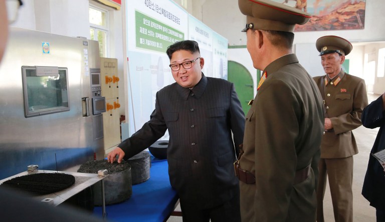 In this undated photo distributed Wednesday, Aug. 23, 2017, Kim Jong Un visits the Chemical Material Institute of Academy of Defense Science at an undisclosed location in North Korea.(Korean Central News Agency/Korea News Service via AP)