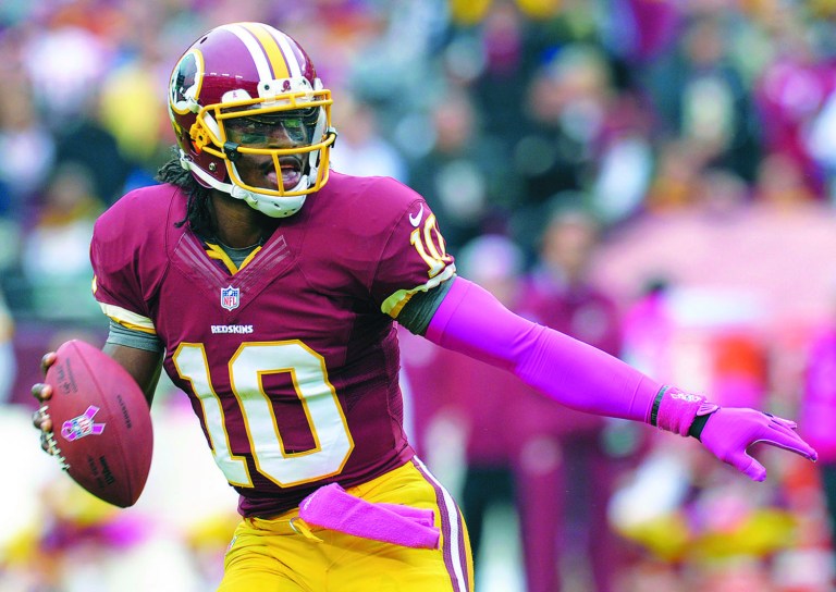 Susan Walsh/AP
Robert Griffin III passed conditioning tests Tuesday and will practice Wednesday.
