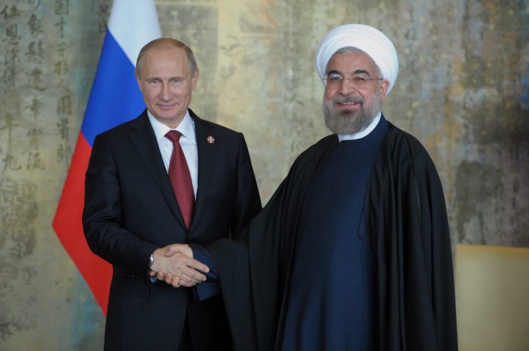 Russia's President Vladimir Putin, left, and Iranian President Hassan Rouhani meet in Shanghai, China. (AP/RIA Novosti, Alexei Druzhinin, Presidential Press Service)