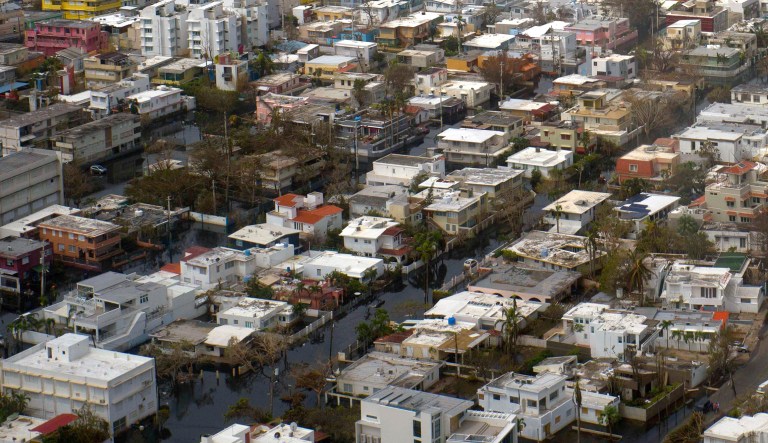 The least Washington can do for an ailing San Juan is to free it from the Jones Act, so that a stricken community can recover faster and move on to a more prosperous future. (AP Photo/Ramon Espinosa)