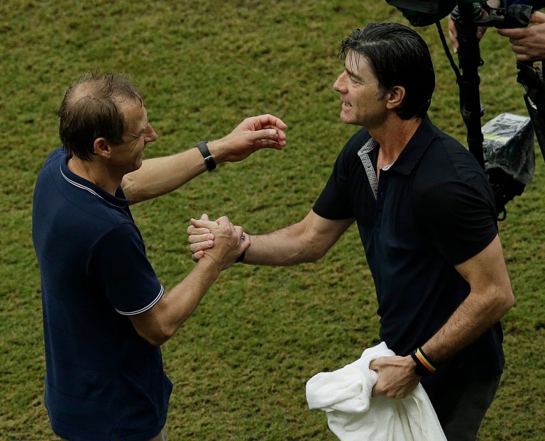 United States' head coach Juergen Klinsmann, left and Germany's head coach Joachim Loew greet each other after the group G World Cup soccer match between the USA and Germany at the Arena Pernambuco in Recife, Brazil, Thursday, June 26, 2014. Germany beat the United States 1-0. (AP Photo/Hassan Ammar)
