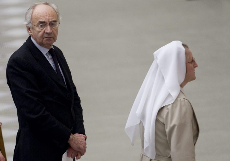FILE -  In this Wednesday, Dec. 21, 2011 file photo Ettore Gotti Tedeschi, left,  the ousted president of the Vatican bank, waits to greet Pope Benedict XVI at the end of a weekly general audience at the Vatican. Gotti Tedeschi, has come out swinging, accusing the bank's board of causing 