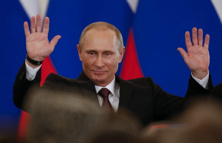 Russian President Vladimir Putin gestures after signing a treaty to incorporate Crimea into Russia in the Kremlin in Moscow on Tuesday. (AP/Alexander Zemlianichenko)