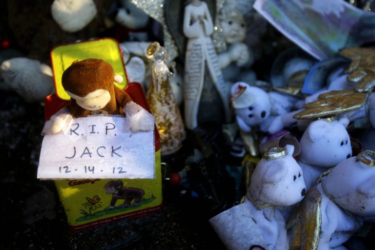   Rain soaks parts of a memorial to the Newtown shooting victims in the Sandy Hook village of Newtown, Conn., Friday, Dec. 21, 2012. The shooter, Adam Lanza, walked into Sandy Hook Elementary School in Newtown, Dec. 14, and opened fire, killing 26 people, including 20 children, before killing himself.Â  (AP Photo/Seth Wenig)  