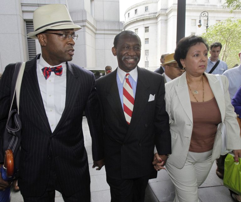 Attorney Anthony Ricco, left, walks with Larry Seabrook, center, a New York City councilman and Seabrook's wife, Maria Diaz, as they leave federal court in New York during Seabrook's corruption trial in 2012. (AP Photo/Richard Drew, File)