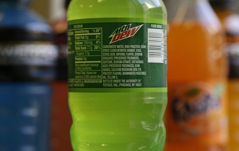 The ingredients on a bottle of Mountain Dew are photographed in San Francisco, Monday, May 5, 2014. Coca-Cola said on Monday it will drop brominated vegetable oil from all its drinks that contain it, not just Powerade. The Atlanta-based company says the controversial ingredient is still being used in some flavors of Fanta and Fresca, as well as several citrus-flavored fountain drinks. (AP Photo/Jeff Chiu)