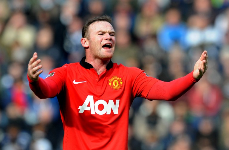 FILE - This is a Saturday, March 8, 2014 file photo of  Manchester United's Wayne Rooney as he  shouts instructions to teammates during the English Premier League soccer match between West Bromwich Albion and Manchester United at The Hawthorns Stadium in West Bromwich, England. Manchester United on Monday July 14, 2014 secured the most lucrative kit deal in football, announcing that Adidas has agreed to pay $1.3 billion over 10 years to take over the sponsorship from Nike. The deal, worth 75 million pounds ($128 million) a year from 2015, was announced after Nike decided that trebling the cost of its existing 13-year equipment supply contract was not good value for the company.  (AP Photo/Rui Vieira, File)