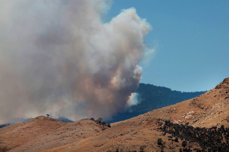 Heavy smoke from the Shirley Fire above Wofford Heights, Calif., is seen Sunday, June 15, 2014. By later Sunday, the fire had burned through 3.1 square miles of trees and brush in and around the Sequoia National Forest, coming within a mile of Wolford Heights, about 30 miles northeast of Bakersfield. Firefighters stopped the flames from reaching homes in Wofford Heights. Authorities have called on residents of the threatened homes to evacuate. (AP photo/The Bakersfield Californian, Casey Christie) MANDATORY CREDIT; MAGS OUT; NO SALES;  TV OUT