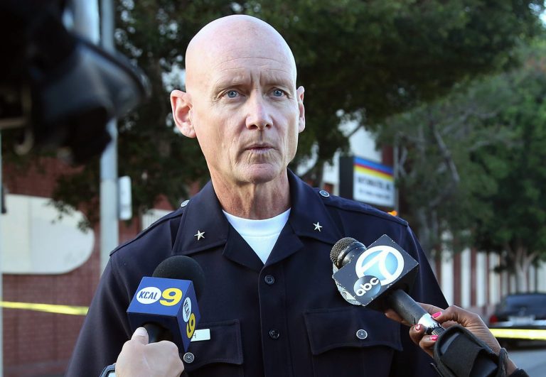Los Angeles Police Department Cmdr. Andrew J. Smith speaks to the media after an early morning police pursuit of an SUV that left an officer with what Smith called 