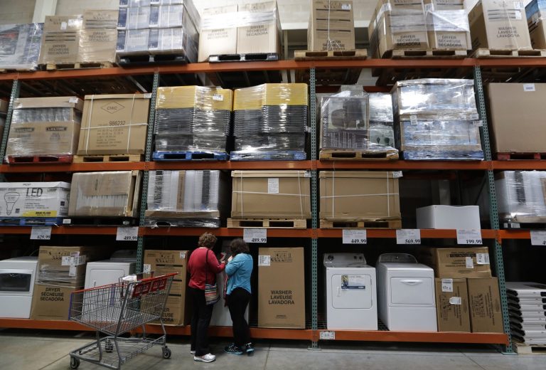 In this June 4, 2014 photo, shoppers look at washers and dryers at a Costco in Plano, Texas. The Commerce Department releases business inventories for April on Thursday, June 12, 2014. (AP Photo/LM Otero)