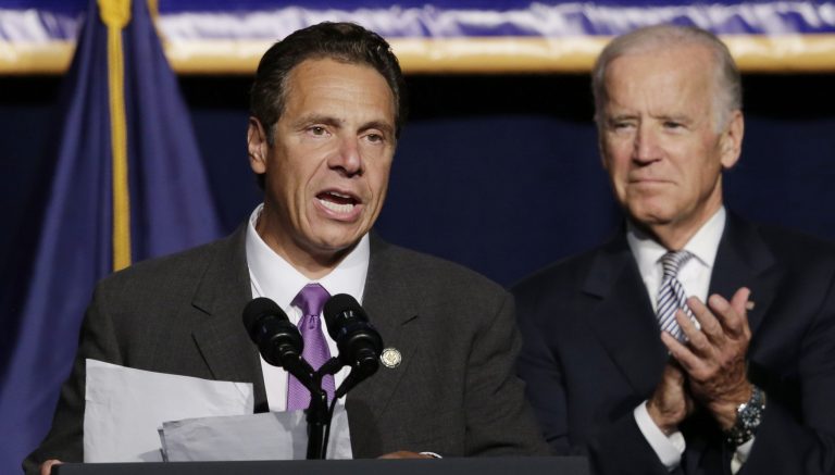 Vice President Joe Biden applauds as New York Gov. Andrew Cuomo speaks at a labor rally, Thursday, Sept. 10, 2015, in New York. (AP Photo/Mark Lennihan)