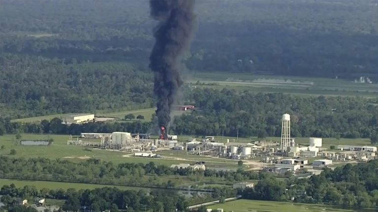 Smoke rises from a chemical plant in Crosby, near Houston, Texas, Friday, Sept. 1, 2017. Thick black smoke and towering orange flames shot up Friday from the flooded Houston-area chemical plant after two trailers of highly unstable compounds blew up a day earlier after losing refrigeration. Arkema says Harvey's floodwaters engulfed its backup generators and knocked out the refrigeration necessary to keep it's nine containers of organic peroxides from degrading and catching fire. 