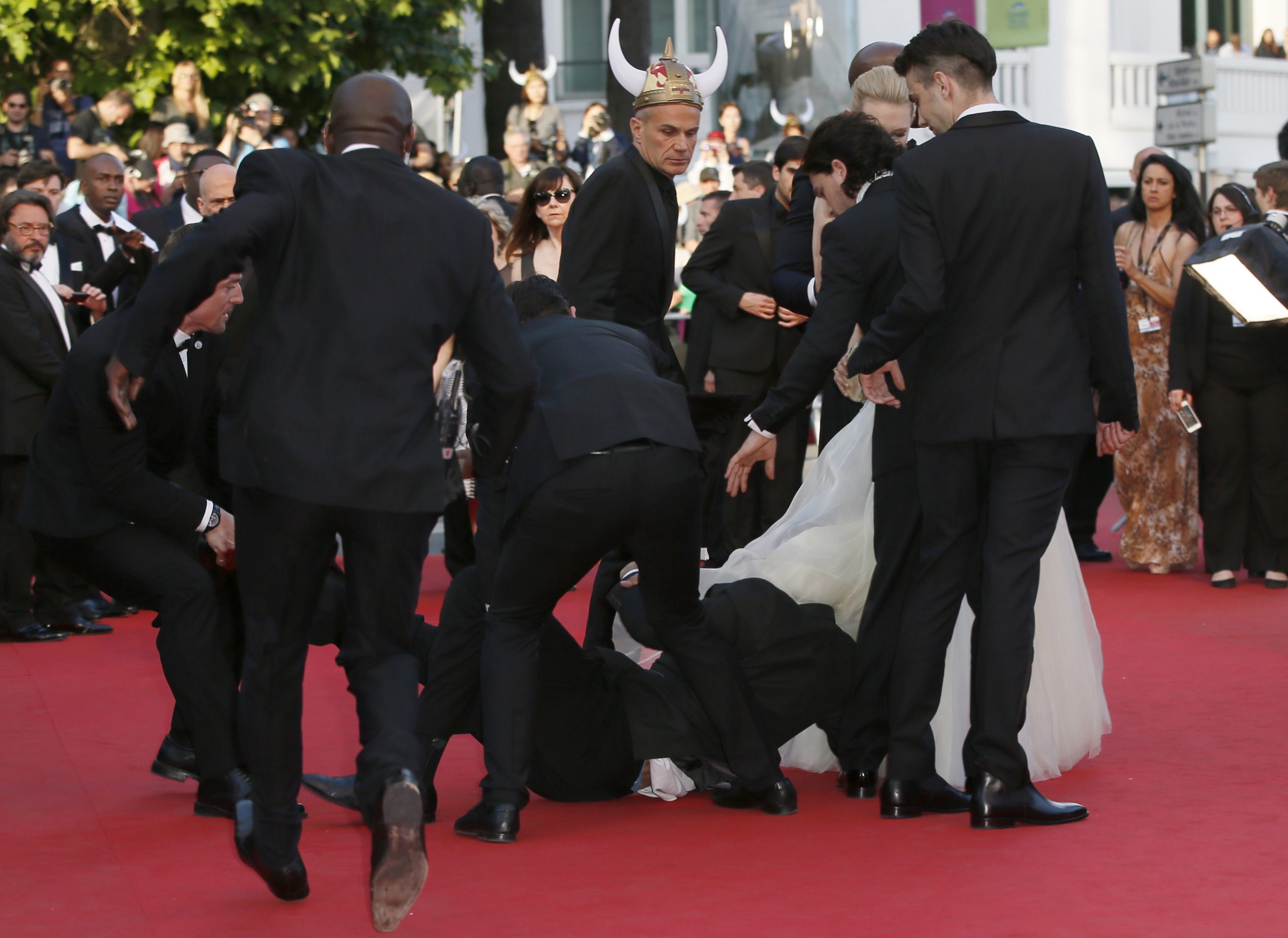 Man dives under star’s dress on Cannes red carpet