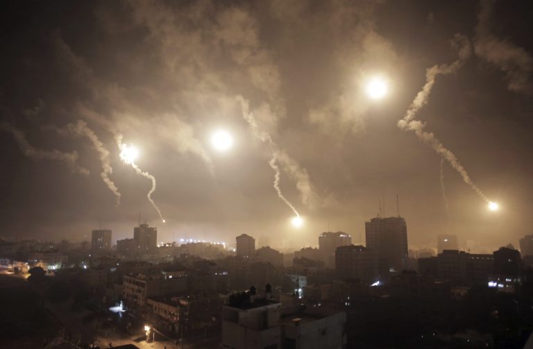 Israeli forces' flares light up the night sky of Gaza City on Tuesday. (AP/Khalil Hamra)
