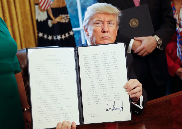President Trump signed an executive order that will direct the Treasury secretary to review the 2010 Dodd-Frank financial oversight law, which reshaped financial regulation after 2008-2009 crisis. (AP Photo/Pablo Martinez Monsivais)
