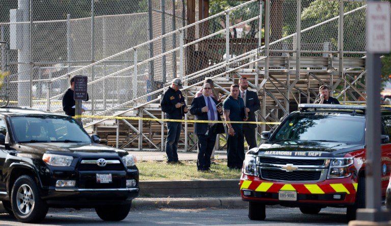 Law enforcement officers investigate the scene where House Majority Whip Steve Scalise of La. was shot at a congressional baseball practice. Scalise described for the first time the moments after he was shot at the GOP baseball practice in June. (AP Photo/Alex Brandon)