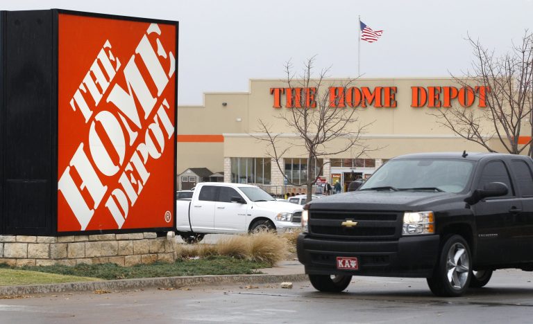 FILE - In a Nov. 14, 2011, file photo, a truck pulls out of the parking lot at a Home Depot store in Oklahoma City. Home Depot Inc. reports quarterly earnings on Tuesday, May 20, 2014. (AP Photo/Sue Ogrocki, File)