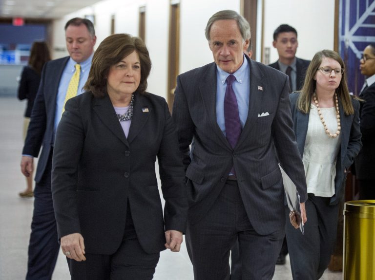 United States Secret Service director Julia Pierson and Senate Homeland Security Committee Chairman Tom Carper, D-Del., leave a committee hearing on recent Secret Service agents behavior, on Capitol Hill in Washington, Tuesday, April 1, 2014. (AP Photo/Cliff Owen)
