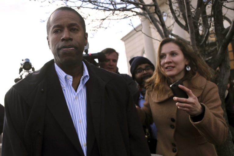 FILE - In this April 2, 2013 file photo State Sen. Malcolm Smith, D-Queens, leaves federal court in White Plains, N.Y.   Accused of trying to bribe his way onto the New York City mayoral ballot, Smith says he didn't do it - and if he did, he was lured into it by federal agents. His trial begins this week in White Plains, in the midst of his re-election campaign in Queens. (AP Photo/Mary Altaffer, File)