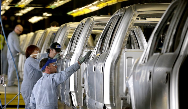 In this 2015 photo, workers inspect the new aluminum-alloy body Ford F-150 trucks before they get painted at the company's Kansas City Assembly Plant in Claycomo, Mo. Heidi Brock, president of the Aluminum Association, said the Trump administration needs to support strong fuel efficiency standards for cars and trucks to undergird that investment, since the rules are projected to cause a transition from steel to lighter aluminum use in vehicle chassis to make cars and pickup trucks lighter to meet the standards. (AP Photo/Charlie Riedel, File)