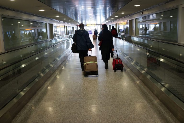 Travelers walk through John F. Kennedy Airport on February 28, 2013 in New York City. (Photo by Spencer Platt/Getty Images)