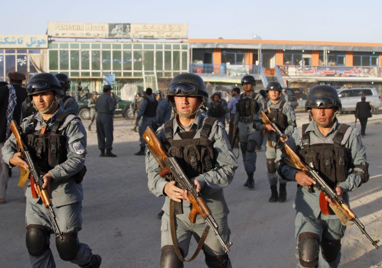 Ahmad Jamshid/AP
Afghan Policemen scan for Taliban fighters near the site of an attack at Kabul airport in Afghanistan last Monday. White House officials said the U.S. and Afghanistan governments will use the negotiating table to ask the Taliban to cut ties with al Qaeda.