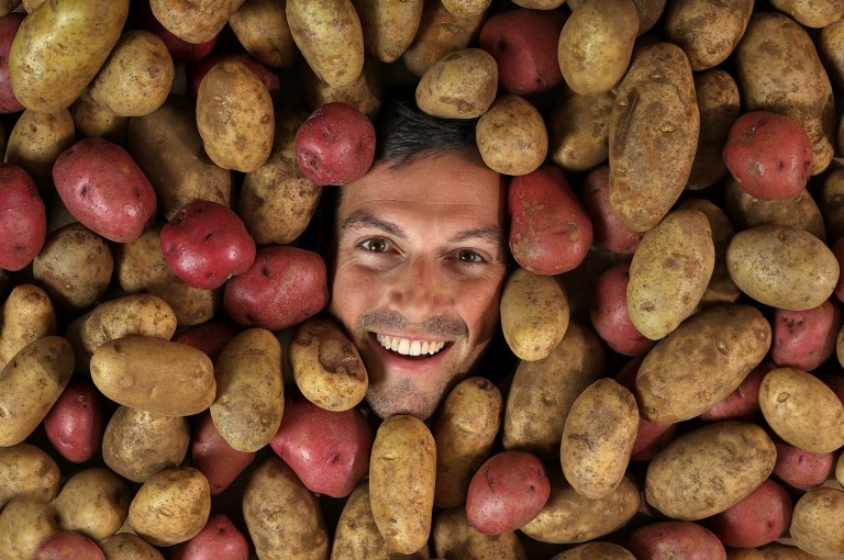 Zack Brown, the man behind the potato salad Kickstarter campaign is photographed on Sept. 18, 2014 in Columbus, Ohio.  Brown is planning PotatoStock 2014, an all-ages, charity-minded party Saturday in downtown Columbus featuring bands, food trucks, beer vendors, potato-sack races and definitely potato salad. His effort on Kickstarter in early July to buy potato salad ingredients took on a life of its own and attracted worldwide attention as the amount grew. The 31-year-old eventually raised $55,492. (AP Photo/The Columbus Dispatch, Chris Russell)