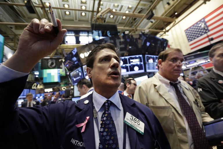 FILE - In this Friday, April 11, 2014 photo, trader Anthony Carannante, left, works on the floor of the New York Stock Exchange. A government report showing March retail sales notched their biggest increase in 18 months helped give U.S. stocks a lift Monday, April 14, 2014. Better-than-expected results from Citigroup helped ease worries that first-quarter corporate earnings would be weak. (AP Photo/Richard Drew, File)