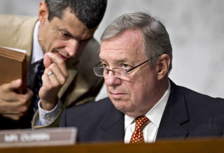 An aide whispers to Sen. Dick Durbin, D-Ill., as the Senate Judiciary Committee questions top Obama administration officials about the National Security Agency's surveillance programs for the first time since the House narrowly rejected a proposal last week to effectively shut down the NSA's secret collection of hundreds of millions of Americans' phone records, on Capitol Hill in Washington, Wednesday, July 31, 2013. After NSA systems analyst Edward Snowden leaked documents revealing the NSA's monitoring of American's telephone records, Judiciary Chairman Sen. Patrick Leahy, D-Vt., introduced legislation that would increase congressional oversight of the program.  (AP Photo/J. Scott Applewhite)