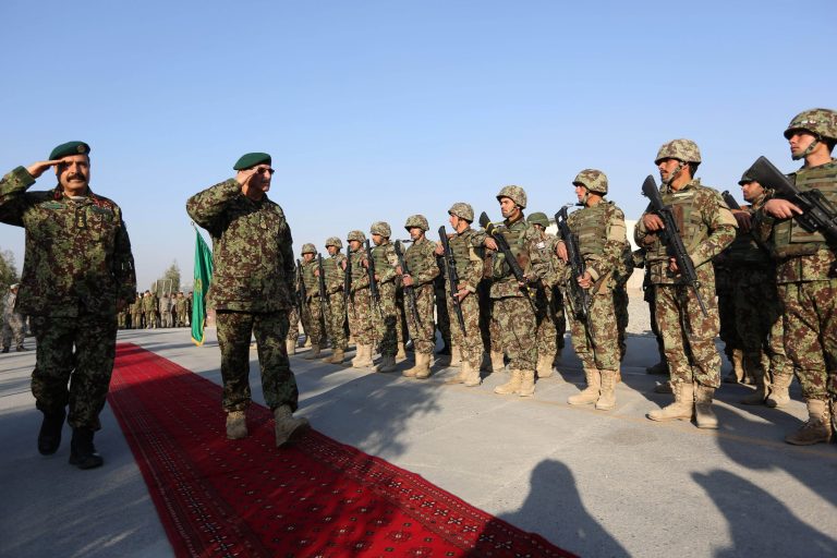 Lt. Gen. Shir Mohammad Karimi, chief of staff of the Afghan defense ministry, second left, salutes during a ceremony in Laghman province, east of Kabul, Afghanistan, Sunday, Jan. 11, 2015. (AP Photo/Rahmat Gul)