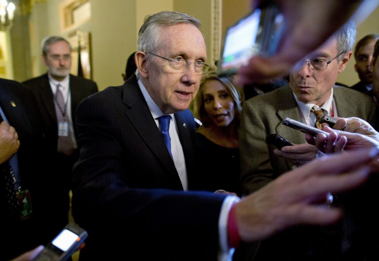 Senate Majority Leader Harry Reid, D-Nev., is surrounded by reporters after leaving the office of Senate Minority Leader Mitch McConnell, R-Ky. Reid reported progress toward a deal to avoid a threatened default and end a two-week partial government shutdown as President Obama called congressional leaders to the White House to press for an end to the impasse. (AP Photo/ Evan Vucci)