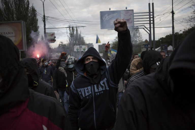 A pro Ukrainian man chants slogans against Russian president Vladimir Putin, during a pro Ukraine rally in Donetsk, Ukraine, Monday, April 28, 2014. About a thousand pro-Russian activists armed with sticks and steel rods attacked the participants of pro-Ukrainian rally in center of Donetsk. Ukraine's acting government and the West have accused Russia of orchestrating the unrest, which they fear Moscow could use as a pretext for an invasion.(AP Photo/Manu Brabo)