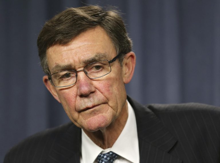 FILE - In this April 7,2014 file photo, the chief coordinator of the Joint Agency Coordination Center retired Chief Air Marshall Angus Houston listens to a question from the media during a press conference about the ongoing search operations for missing Malaysia Airlines Flight 370 in Perth,  Australia. Houston has become the global face of the massive monthlong search operation off Australia's west coast to find the missing Boeing 777, which is believed to be resting somewhere on the silt-covered bottom of the Indian Ocean in a patch the size of Los Angeles. (AP Photo/Rob Griffith, File)