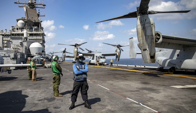 Sailors and Marines conduct flight operations on the flight deck aboard the Wasp-class amphibious assault ship USS Kearsarge (LHD 3) deployed to the U.S. 5th Fleet area of operations on Feb. 11, 2019.